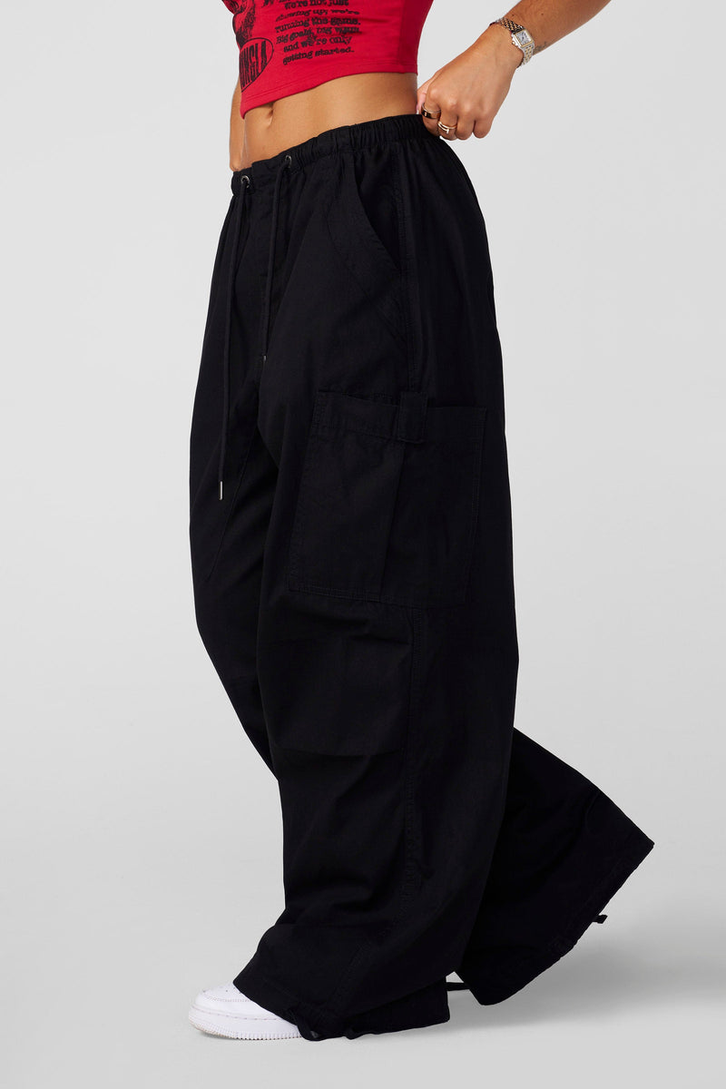 W283 Off-Duty pants- Off Duty Baggy Pants in soft, breathable cotton with oversized fit, adjustable ankle ties, and drawstring waist, combining relaxed comfort with street-ready style in Black