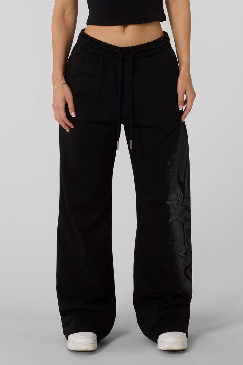 W281 Flashback Joggers- Lightweight, breathable 2000-inspired joggers with a bold airbrushed logo, oversized low-rise fit, and adjustable drawstrings for comfort and style in Black