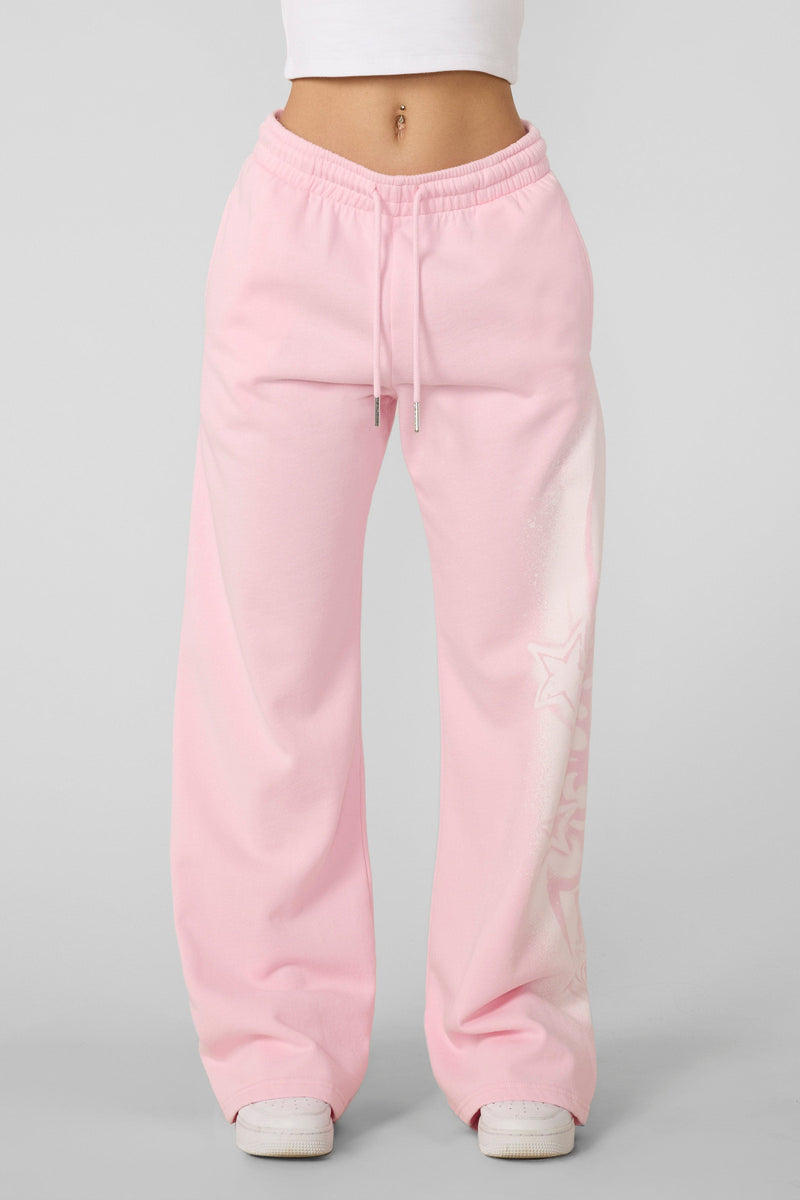 W281 Flashback Joggers- Lightweight, breathable 2000-inspired joggers with a bold airbrushed logo, oversized low-rise fit, and adjustable drawstrings for comfort and style in Light Pink