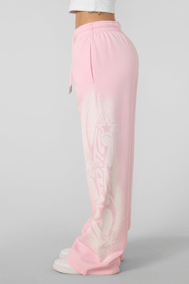 W281 Flashback Joggers- Lightweight, breathable 2000-inspired joggers with a bold airbrushed logo, oversized low-rise fit, and adjustable drawstrings for comfort and style in Light Pink