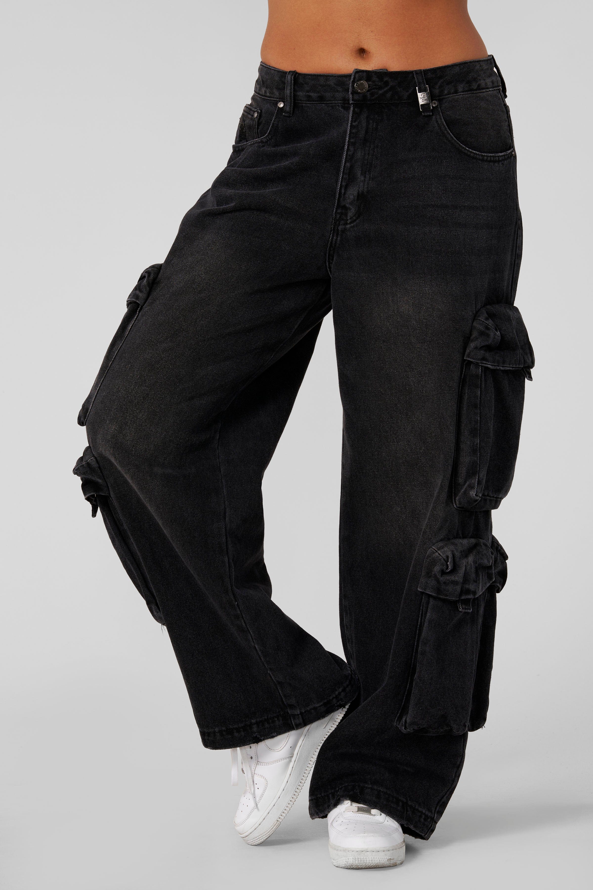 W231 - Drift Cargo Jeans - Oversized streetwear jeans with unique cargo pockets and hidden waistband adjusters for a customizable fit. Tall-friendly with an elongated inseam. Perfect with sneakers or heels for effortless style in Black Wash.