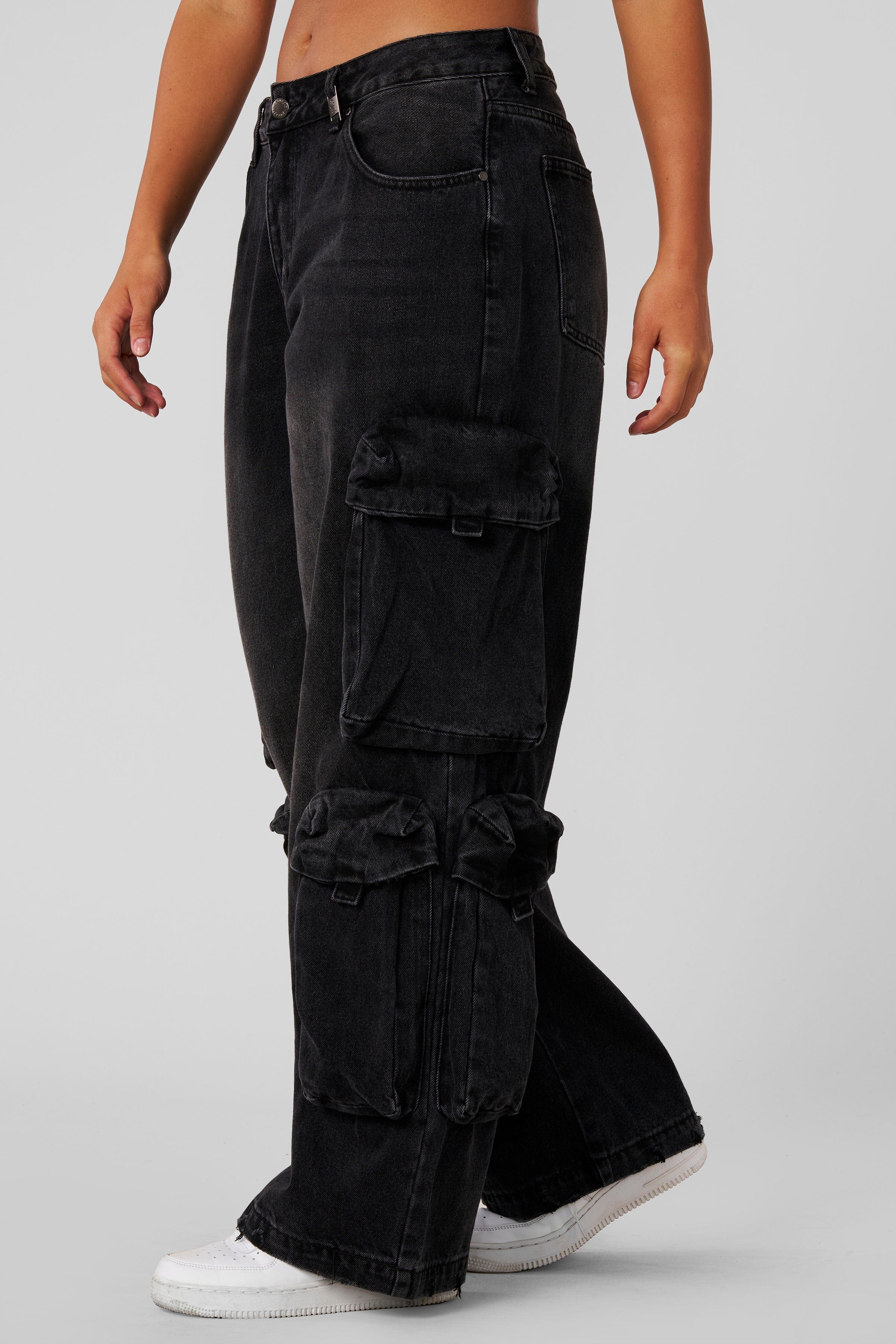 W231 - Drift Cargo Jeans - Oversized streetwear jeans with unique cargo pockets and hidden waistband adjusters for a customizable fit. Tall-friendly with an elongated inseam. Perfect with sneakers or heels for effortless style in Black Wash.