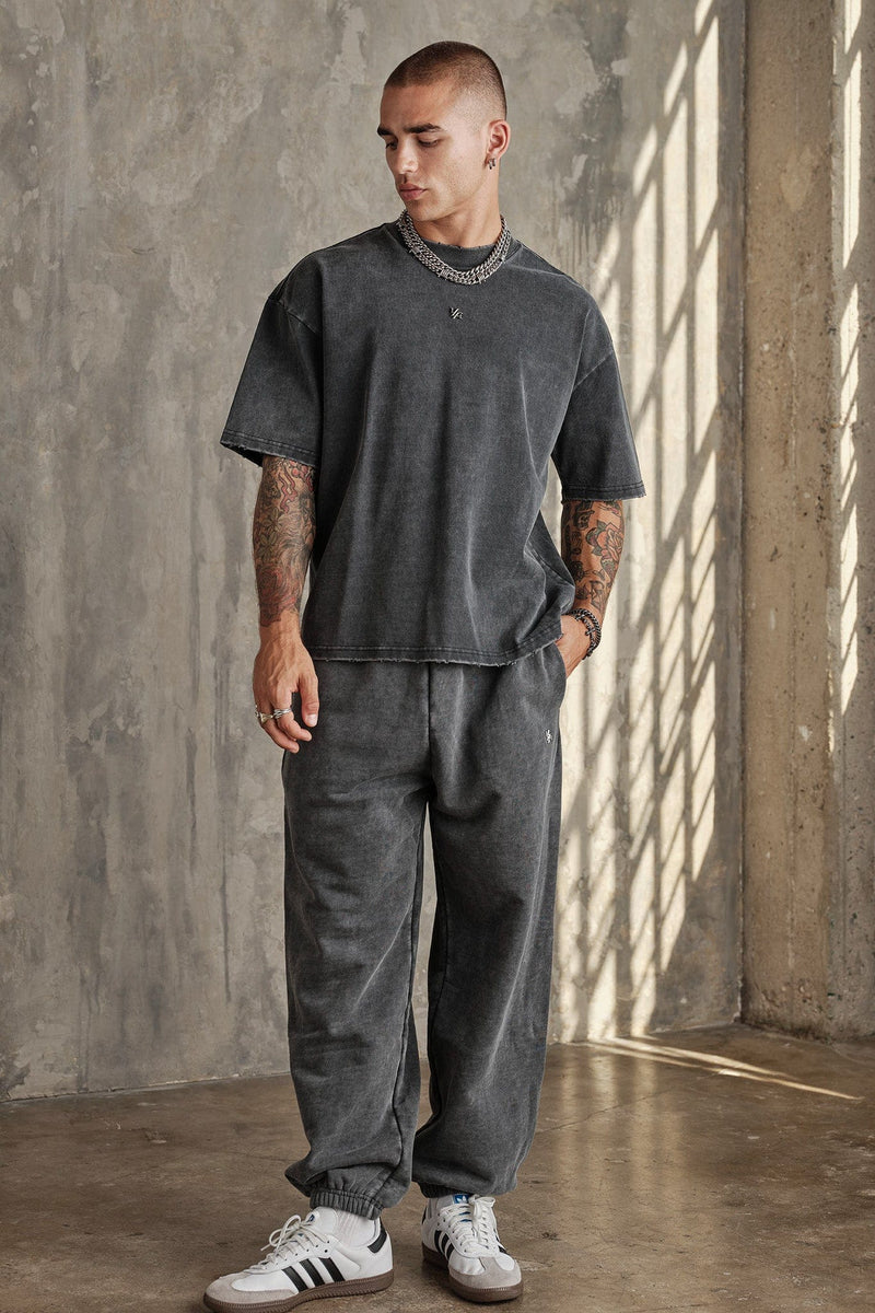 2069 - Elevated Essentials - Baggy Joggers — oversized, comfortable fit with cuffed ankles, structured heavyweight cotton, and subtle “Elevated” branding for a premium, versatile look in Grey Wash