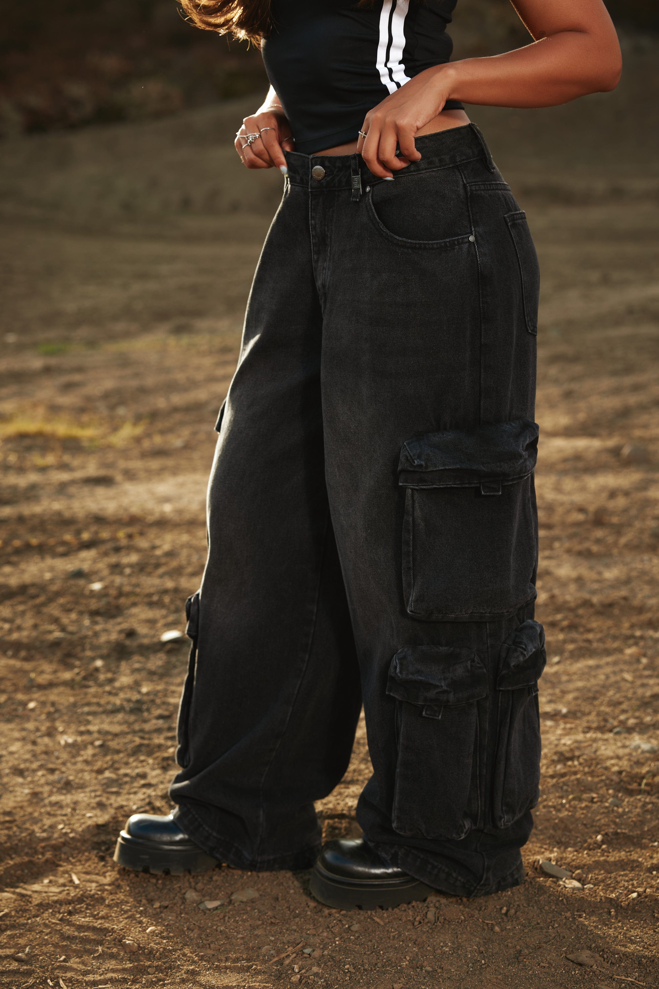 W231 - Drift Cargo Jeans - Oversized streetwear jeans with unique cargo pockets and hidden waistband adjusters for a customizable fit. Tall-friendly with an elongated inseam. Perfect with sneakers or heels for effortless style in Black Wash.