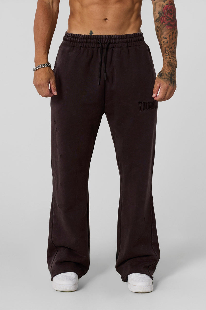 2077 - Flare Sweats - Heavyweight fleece sweats with structure and warmth. Minimal branding and clean lines create a bold, everyday-ready silhouette in Brown Wash.