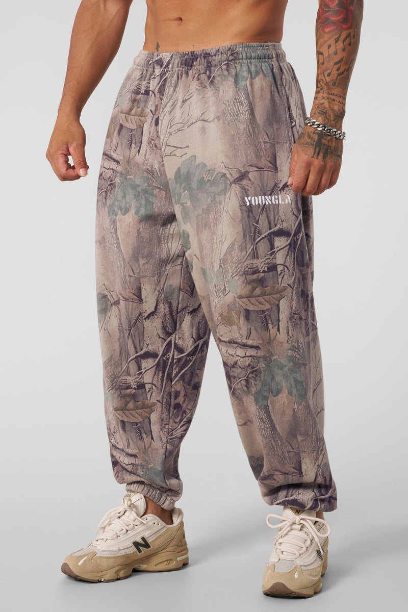 2063 Tree Camo Baggy Joggers — oversized, street-ready comfort with elastic cuffs, durable heavyweight terry, and a relaxed camo fit for everyday wear, in Beige.