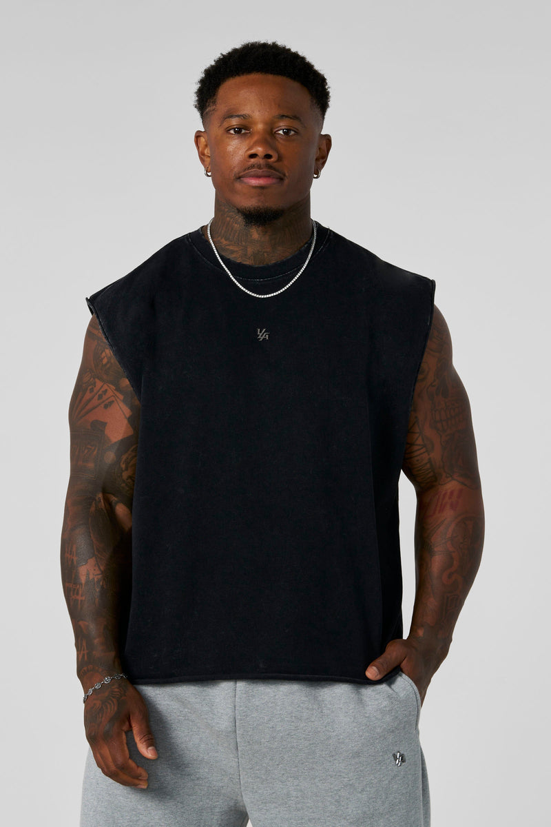 3035 - Elevated Essentials - Cut Offs - Relaxed fleece cut offs with raw-edge hems, lightweight premium cotton, small 'Elevated' logo in colour Black Wash.