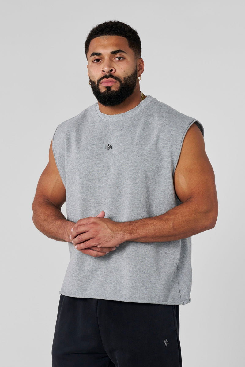 3035 - Elevated Essentials - Cut Offs - Relaxed fleece cut offs with raw-edge hems, lightweight premium cotton, small 'Elevated' logo in colour Heather Grey.