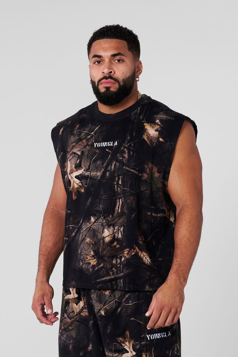 3067 - Tree Camo Collection - Cut Offs - heavyweight terry shorts with raw hems and an above-the-knee fit in colour Black Tree Camo.
