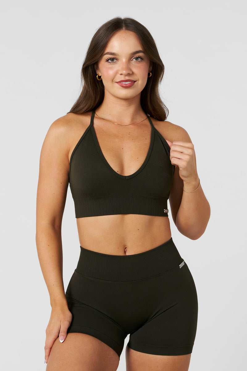 W367 - Sculpt Seamless Plunge Bra - Medium Impact Bra ā ultra-soft seamless design with a flattering deep V-neckline and removable padding for adjustable support in colour Olive.