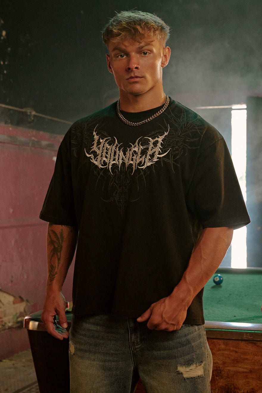 4149 - Gothic Tees- Oversized tee with bold gothic-inspired graphics on the back, structured yet comfortable, offering a sharp, wearable edge and statement-making style in Brown Wash