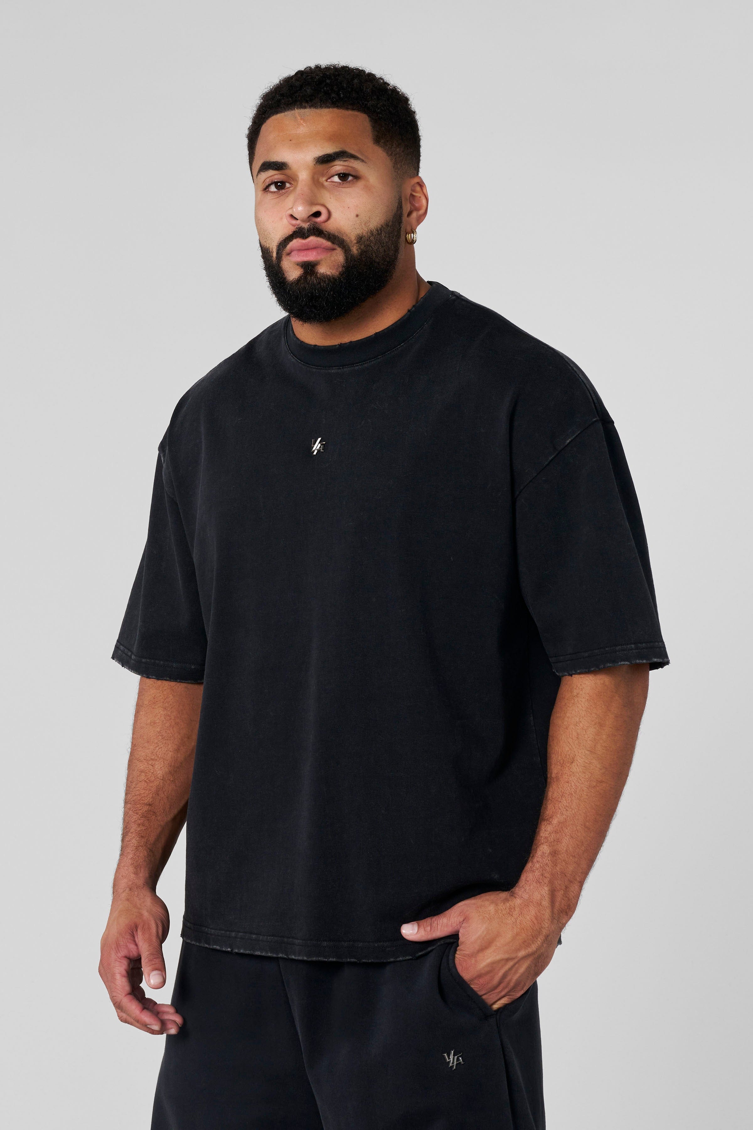 4153 - Elevated Essentials - Relaxed Tee - Oversized heavyweight cotton tee with drop shoulders, natural drape, and subtle 'Elevated' detailing in colour Black Wash.