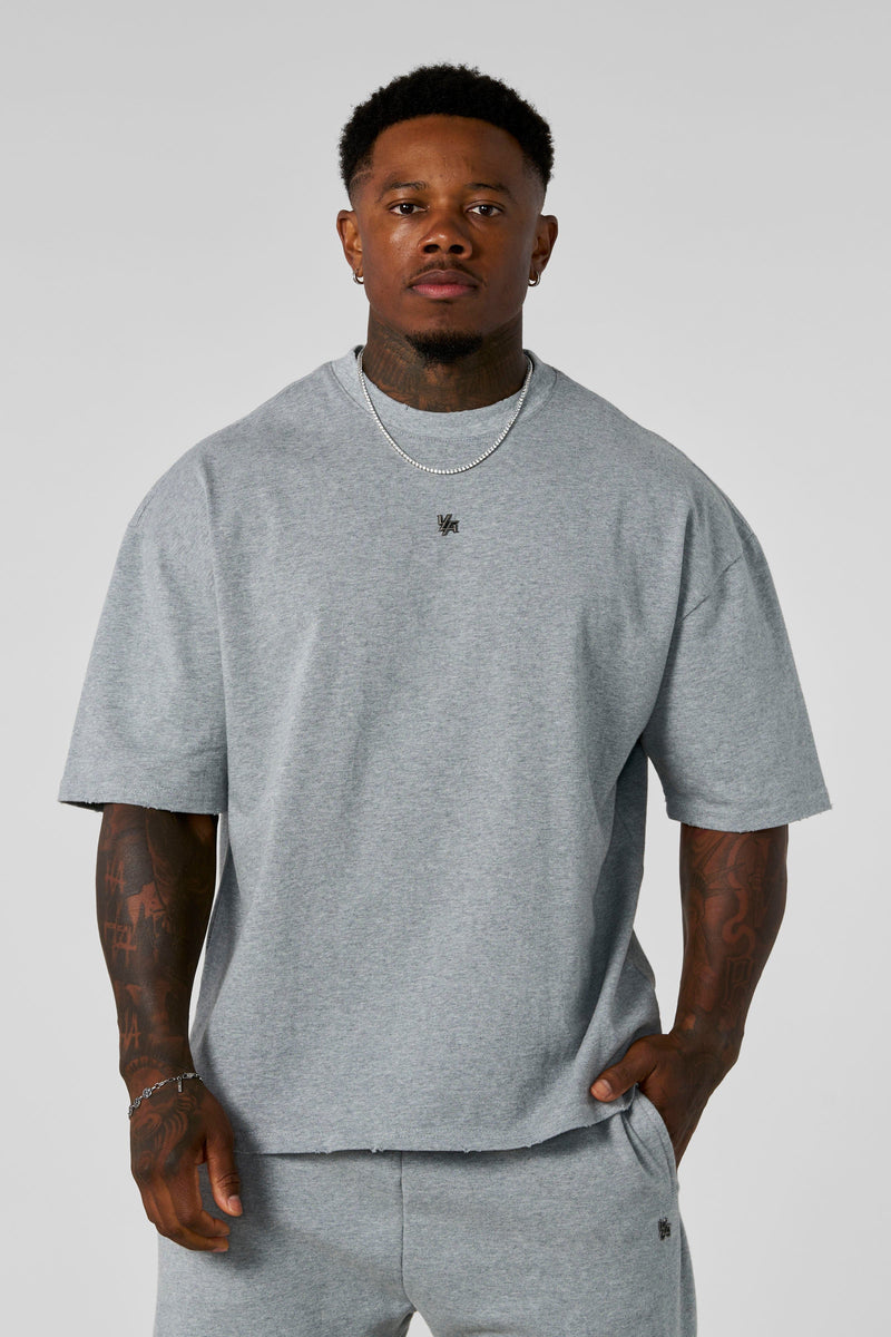 4153 - Elevated Essentials - Relaxed Tee - Oversized heavyweight cotton tee with drop shoulders, natural drape, and subtle 'Elevated' detailing in colour Heather Grey.