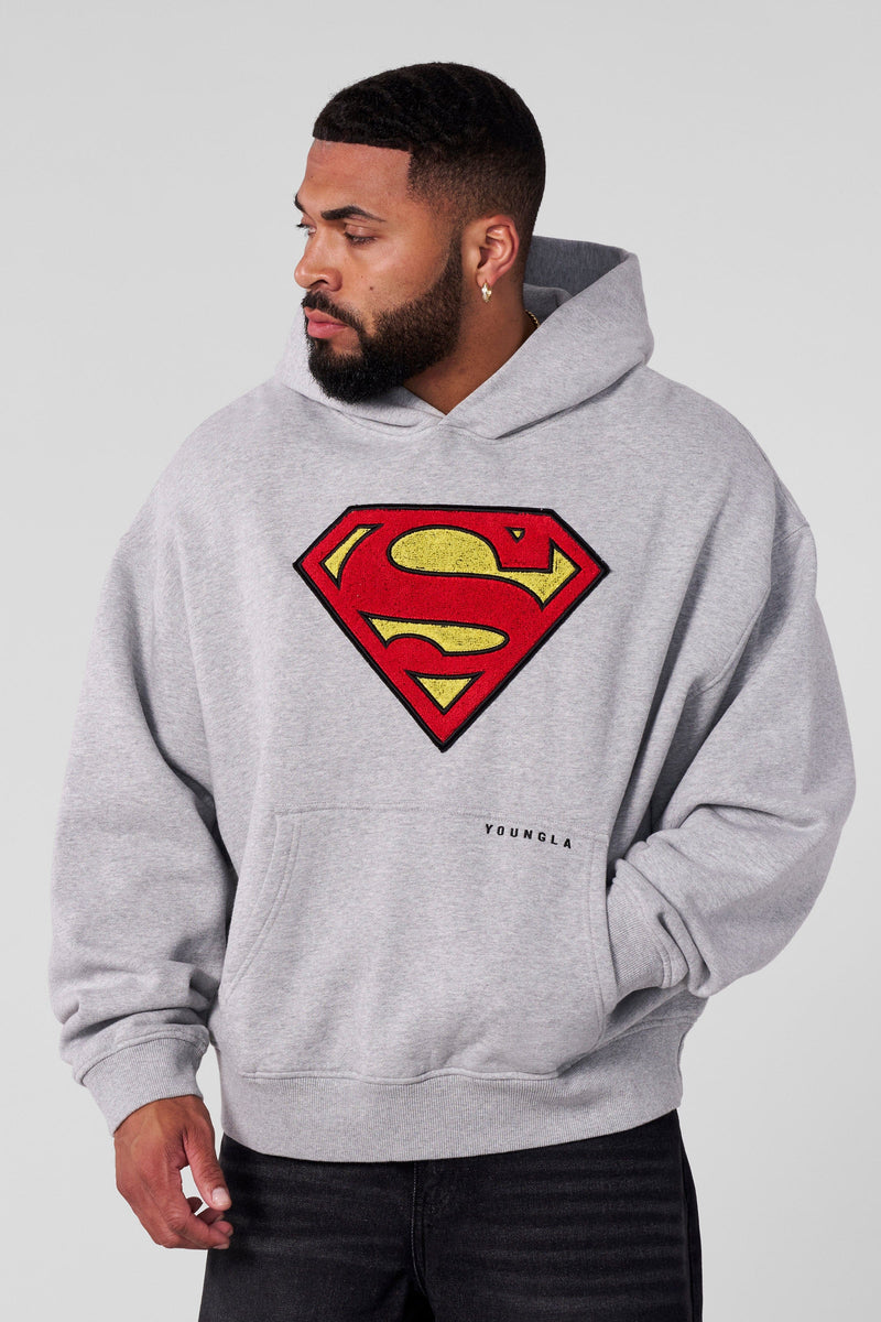5079 - Superman Legacy Hoodies- Superman Legacy Hoodie in 460 GSM soft cotton with relaxed fit, featuring a chenille Superman logo patch on the chest and a clean acid-washed finish in Heather Grey