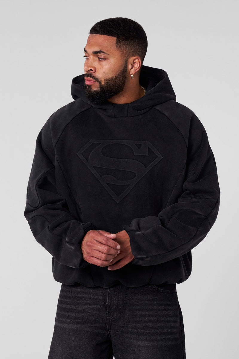 5094 - Superman Shield Hoodies - heavyweight 465 GSM cotton-poly blend with pieced panel cuts and a bold embossed Superman logo in Black Wash.
