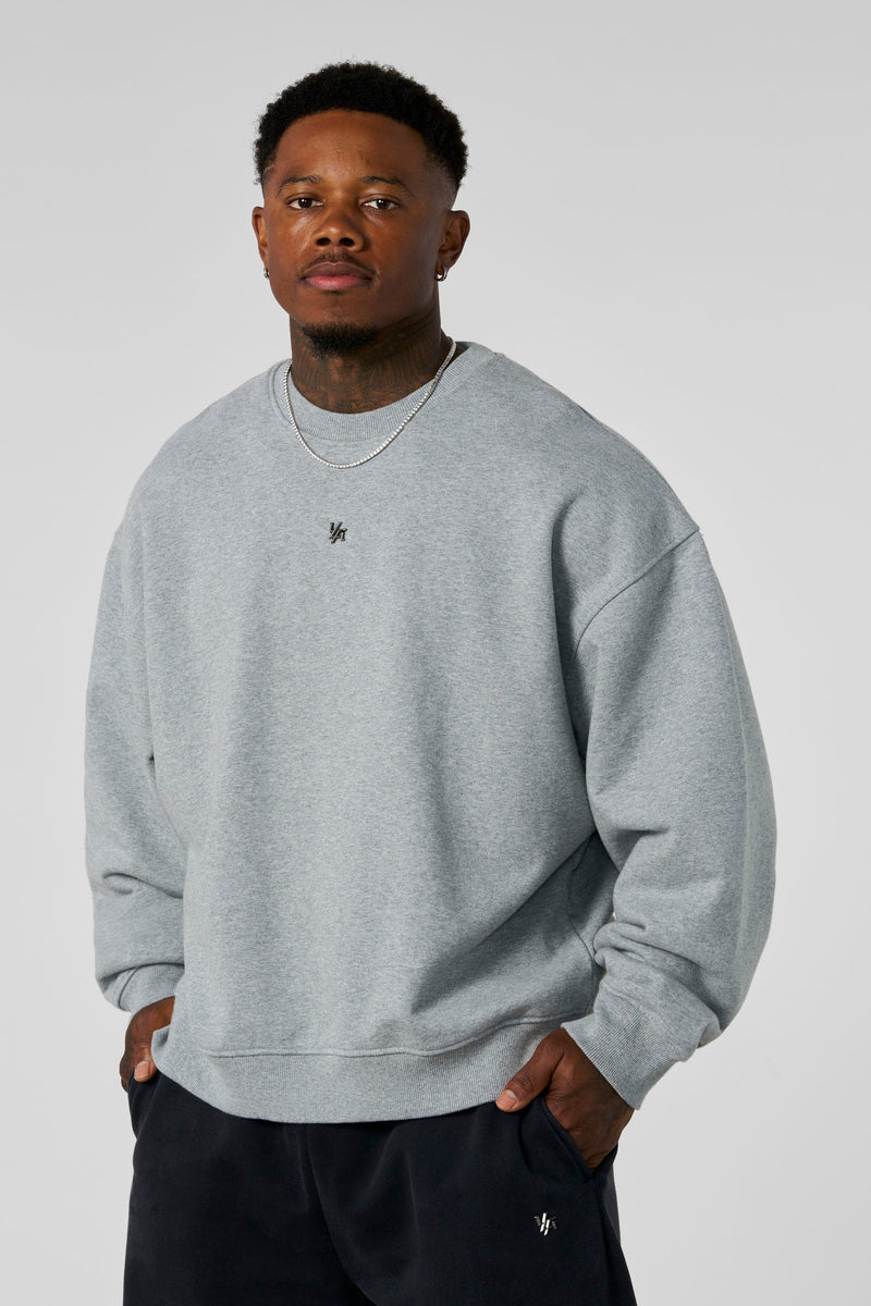 5095 - Elevated Essentials - Crewneck - Heavyweight cotton crewneck with a relaxed fit and ribbed cuffs. Soft interior and minimal 'Elevated' branding for a comfortable, premium everyday essential in Heather Grey.