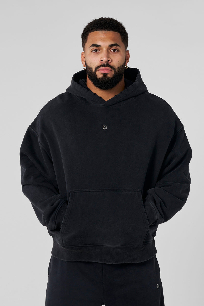 5096 - Elevated Essentials - Pullover Hoodies - Heavyweight cotton hoodie with a spacious fit, kangaroo pocket, and adjustable hood. Subtle 'Elevated' branding for a versatile, modern look in Black Wash.