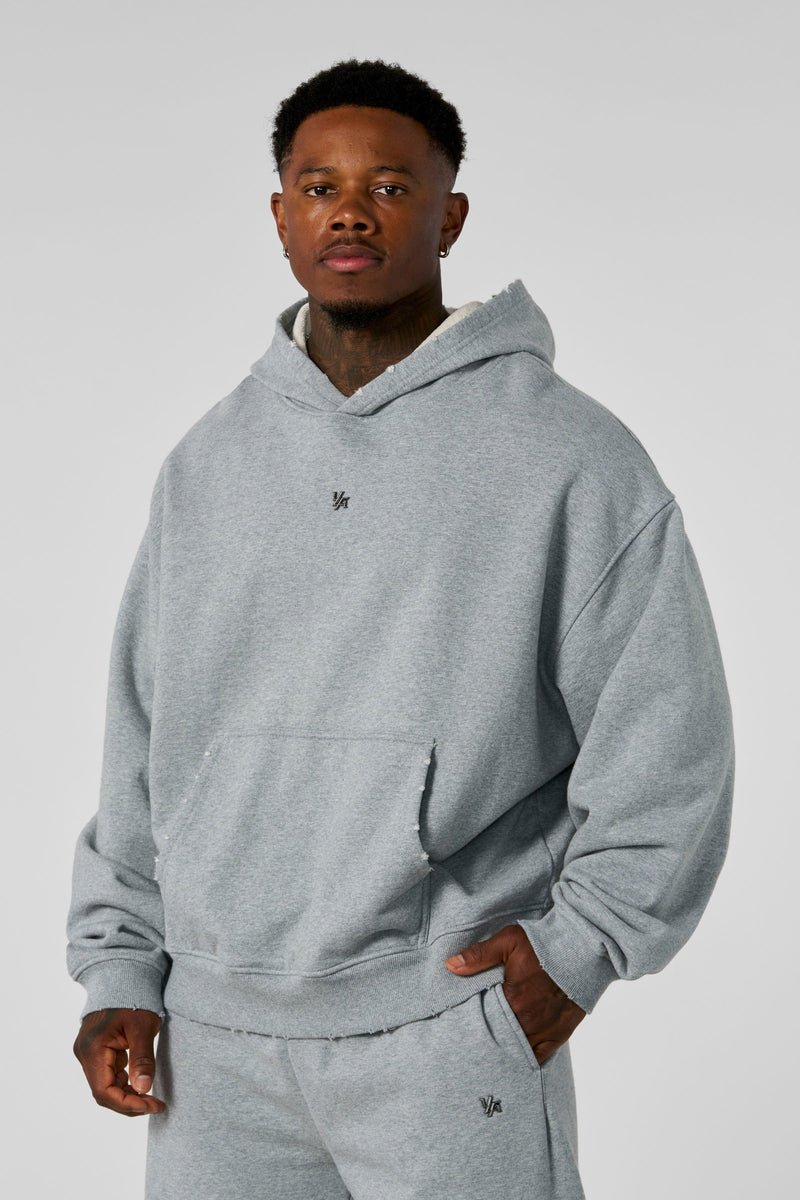 5096 - Elevated Essentials - Pullover Hoodies - Heavyweight cotton hoodie with a spacious fit, kangaroo pocket, and adjustable hood. Subtle 'Elevated' branding for a versatile, modern look in Heather Grey.