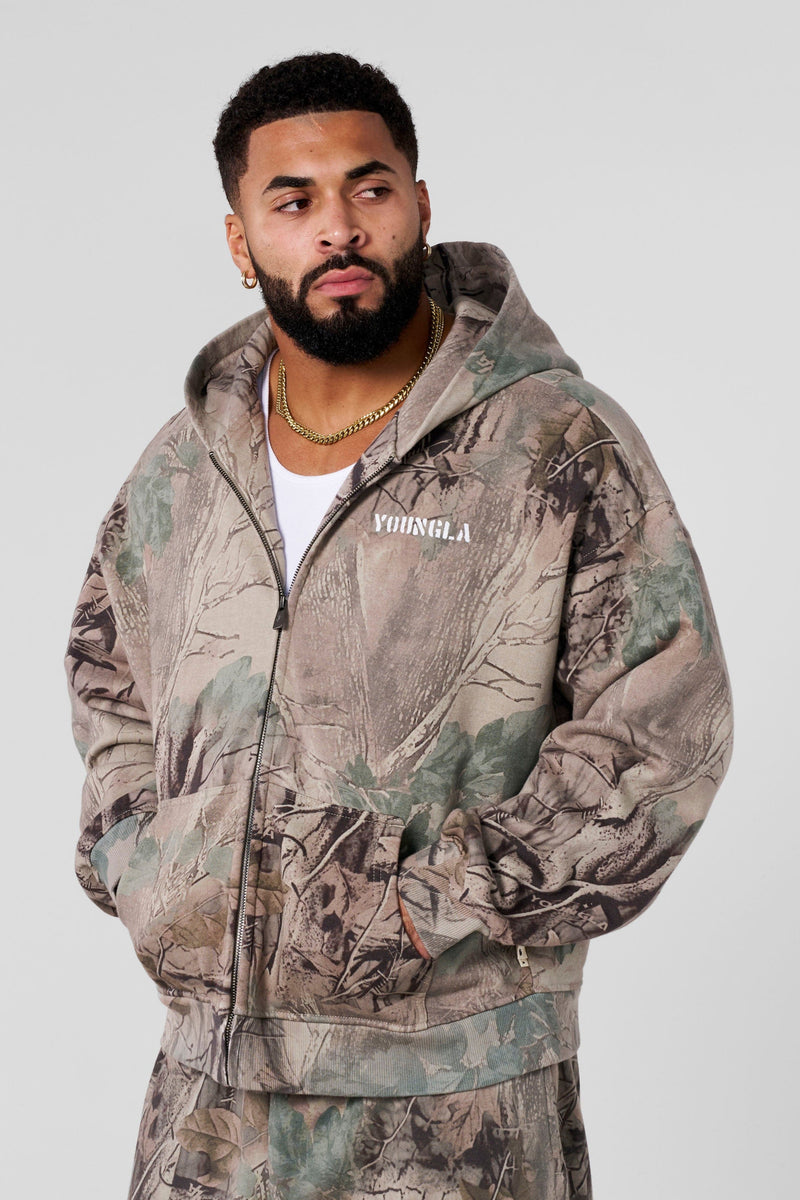 5116 - Tree Camo Collection - Zip Ups - versatile zip-up hoodie with a structured hood, durable zipper, and roomy fit in colour Beige Tree Camo.