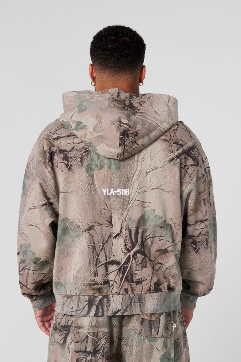 5116 - Tree Camo Collection - Zip Ups - versatile zip-up hoodie with a structured hood, durable zipper, and roomy fit in colour Beige Tree Camo.