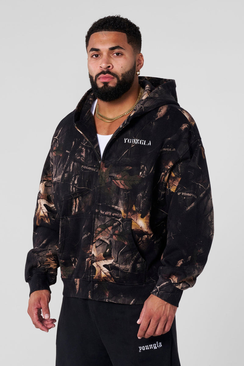 5116 - Tree Camo Collection - Zip Ups - versatile zip-up hoodie with a structured hood, durable zipper, and roomy fit in colour Black Tree Camo.