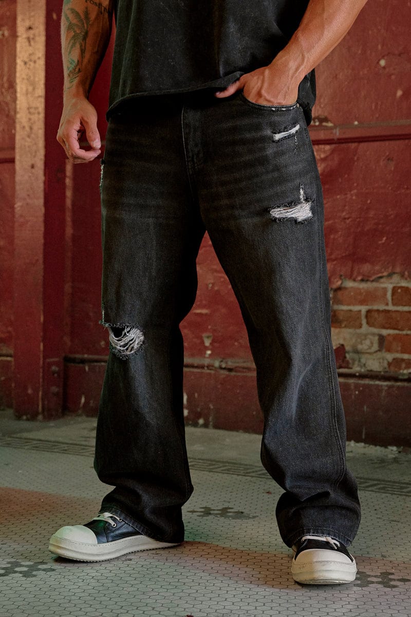 6025 - Straight Fit Ripped Jeans- Straight-leg jeans made from heavy 415 GSM cotton, structured yet softening over time, featuring minimal detailing for a vintage-inspired, timeless look in Black Wash.