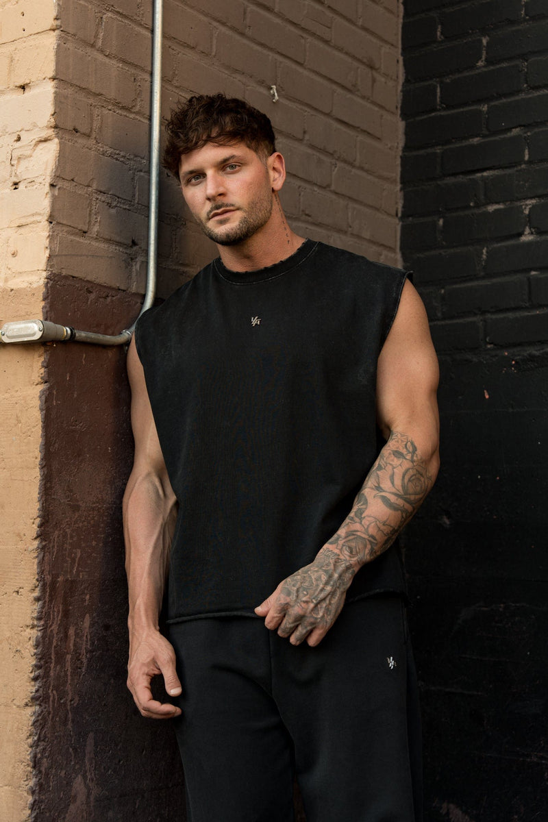 3035 - Elevated Essentials - Cut Offs - Relaxed fleece cut offs with raw-edge hems, lightweight premium cotton, small 'Elevated' logo in colour Black Wash.