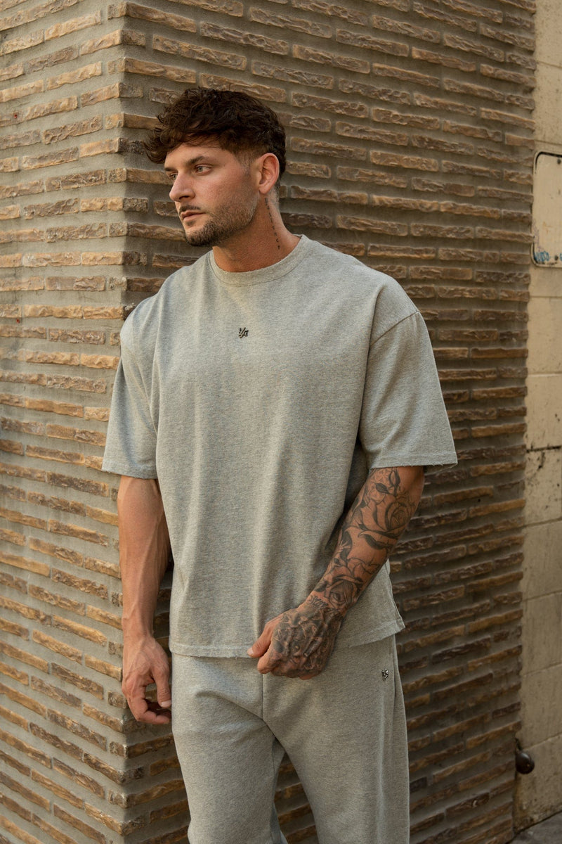 4153 - Elevated Essentials - Relaxed Tee - Oversized heavyweight cotton tee with drop shoulders, natural drape, and subtle 'Elevated' detailing in colour Heather Grey.