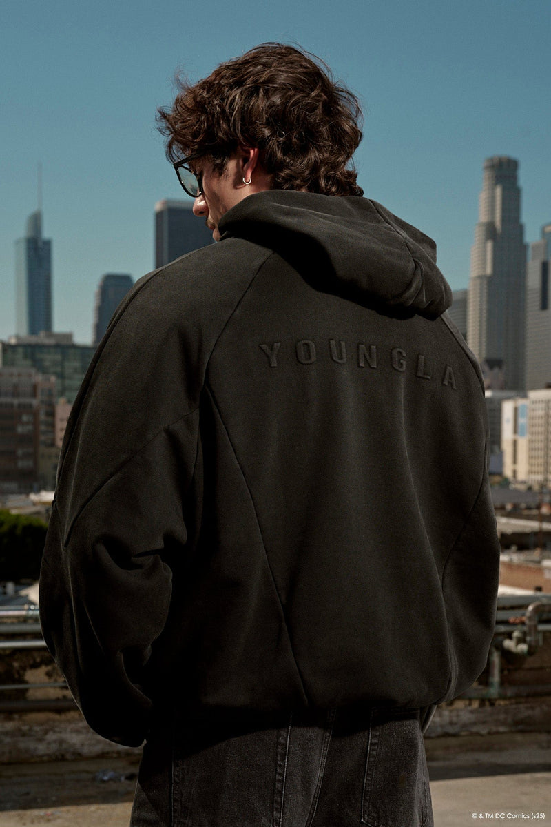 5094 - Superman Shield Hoodies - heavyweight 465 GSM cotton-poly blend with pieced panel cuts and a bold embossed Superman logo in Black Wash.