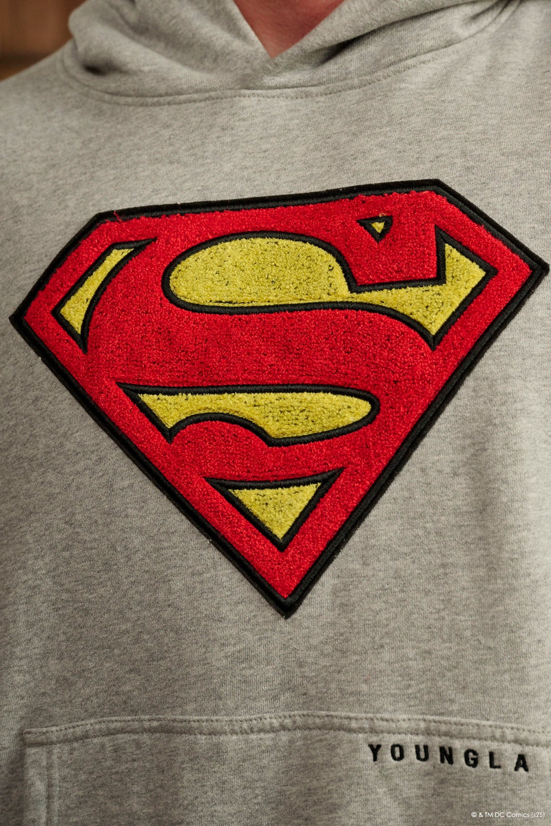 5079 - Superman Legacy Hoodies- Superman Legacy Hoodie in 460 GSM soft cotton with relaxed fit, featuring a chenille Superman logo patch on the chest and a clean acid-washed finish in Heather Wash