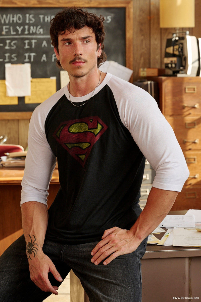 8072 - Superman 3/4 Raglan Shirts - Superman 3/4 Raglan Shirt – Lightweight 150 GSM fabric, soft & breathable, modern fitted cut. Features vintage Superman logo and contrast sleeves for a classic throwback style in Black/White.