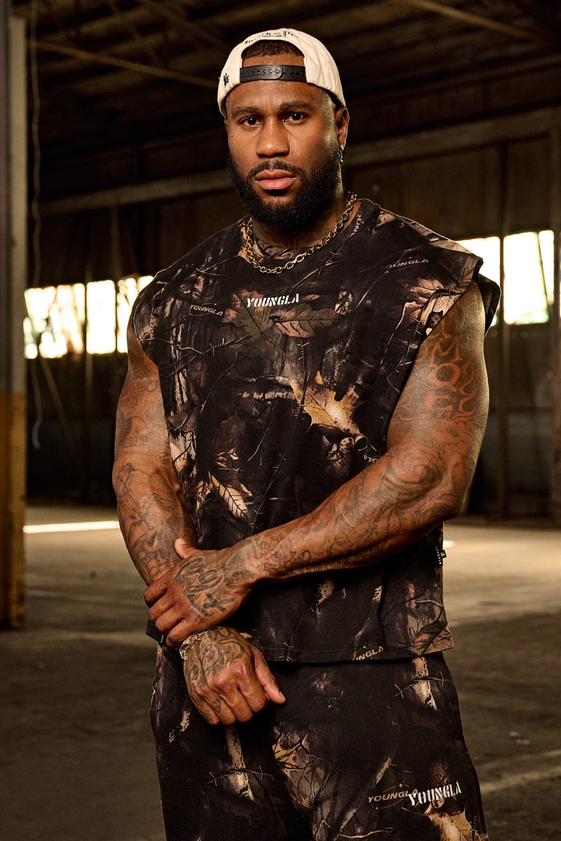 3067 - Tree Camo Collection - Cut Offs - heavyweight terry shorts with raw hems and an above-the-knee fit in colour Black Tree Camo.