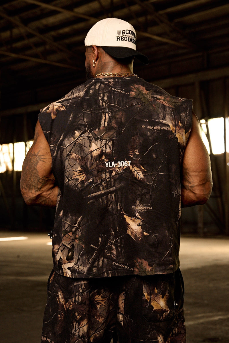 3067 - Tree Camo Collection - Cut Offs - heavyweight terry shorts with raw hems and an above-the-knee fit in colour Black Tree Camo.