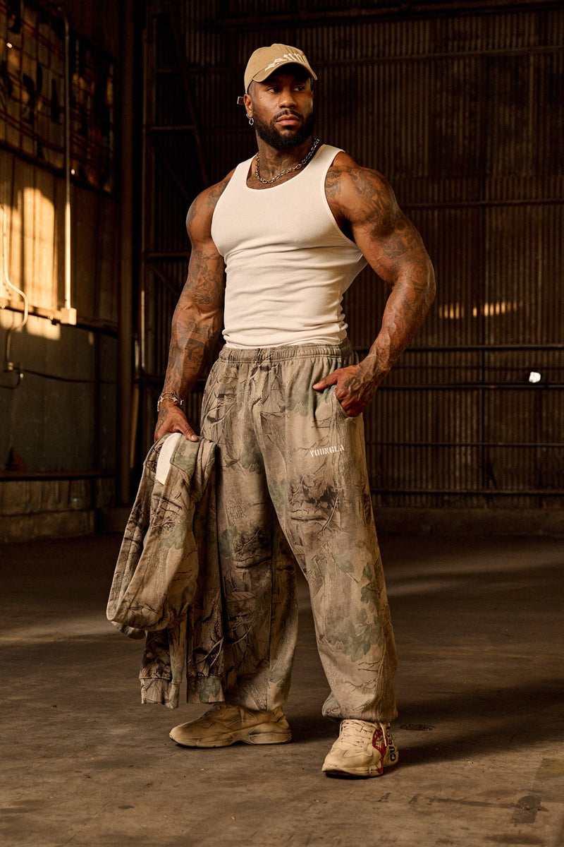 2063 Tree Camo Baggy Joggers — oversized, street-ready comfort with elastic cuffs, durable heavyweight terry, and a relaxed camo fit for everyday wear, in Beige.