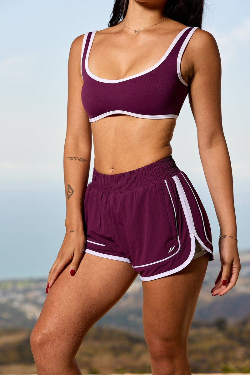 W175 - Elevate Running Shorts -lightweight, breathable top layer with supportive inner shorts, adjustable drawstring waistband, and hidden pockets for secure, comfortable wear in Grape.