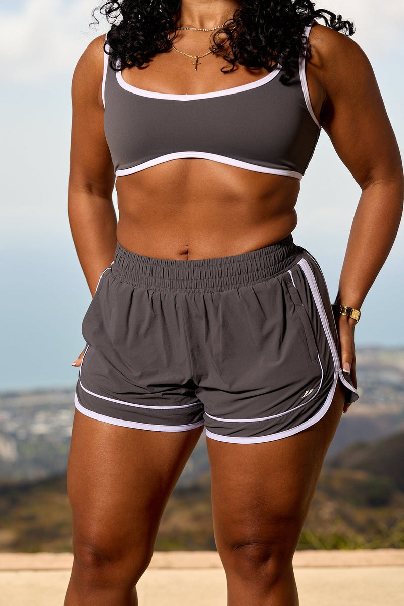 W175 - Elevate Running Shorts -lightweight, breathable top layer with supportive inner shorts, adjustable drawstring waistband, and hidden pockets for secure, comfortable wear in Charcoal.