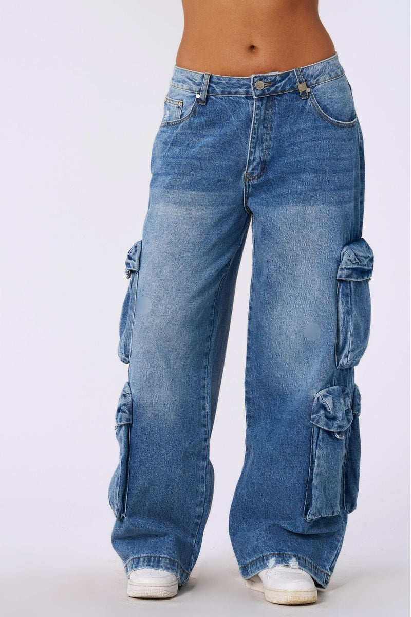 W231 - Drift Cargo Jeans - Oversized streetwear jeans with unique cargo pockets and hidden waistband adjusters for a customizable fit. Tall-friendly with an elongated inseam. Perfect with sneakers or heels for effortless style in Blue Wash.