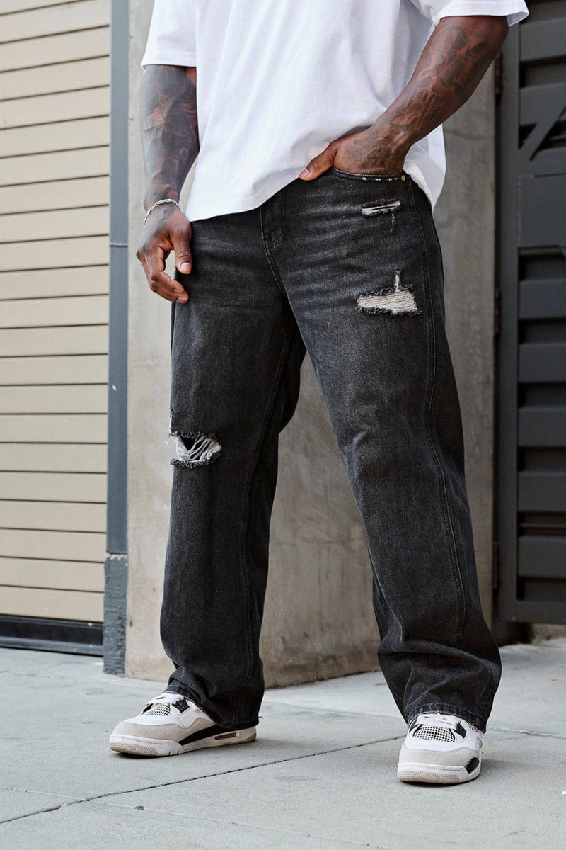 6025 - Straight Fit Ripped Jeans- Straight-leg jeans made from heavy 415 GSM cotton, structured yet softening over time, featuring minimal detailing for a vintage-inspired, timeless look in Black Wash.