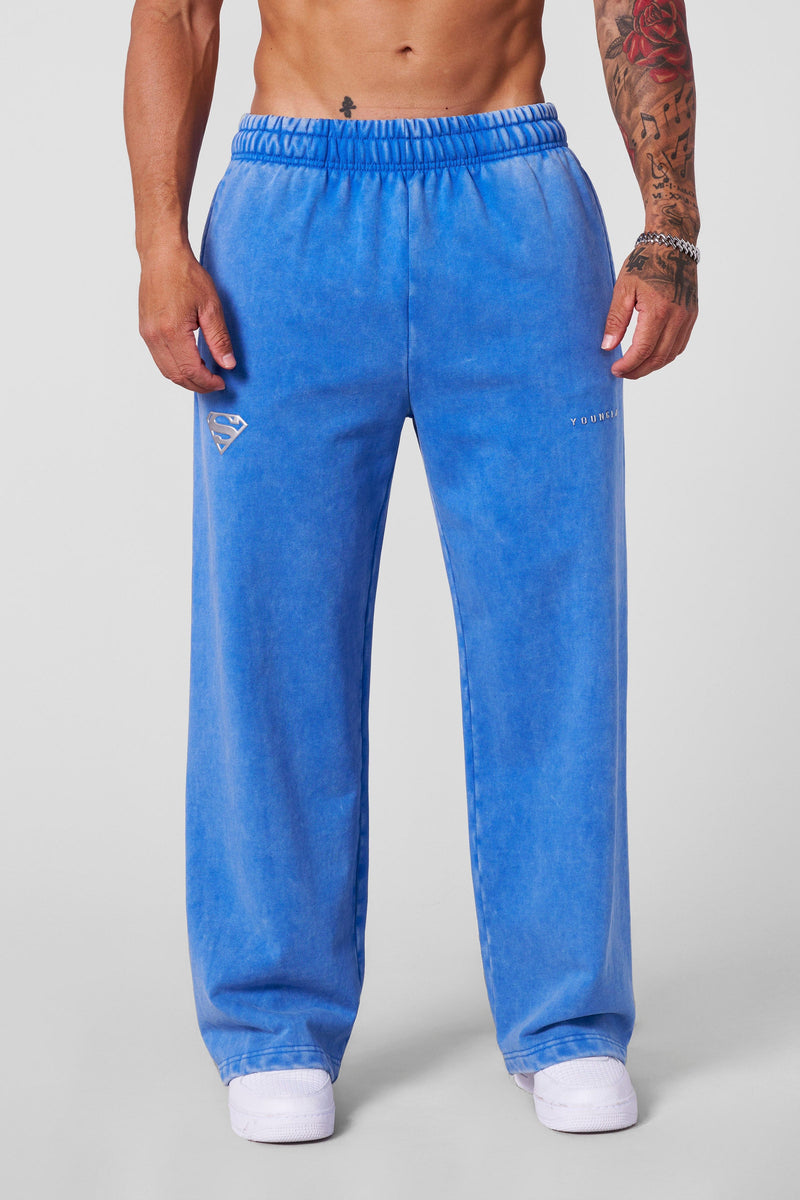 2032 - Superman Sweats - Man of Steel sweatpants from Superman x YoungLA collaboration, acid-wash design, YoungLA chrome logo on left leg, Superman logo on right, baggy fit for comfortable everyday wear in Blue Wash