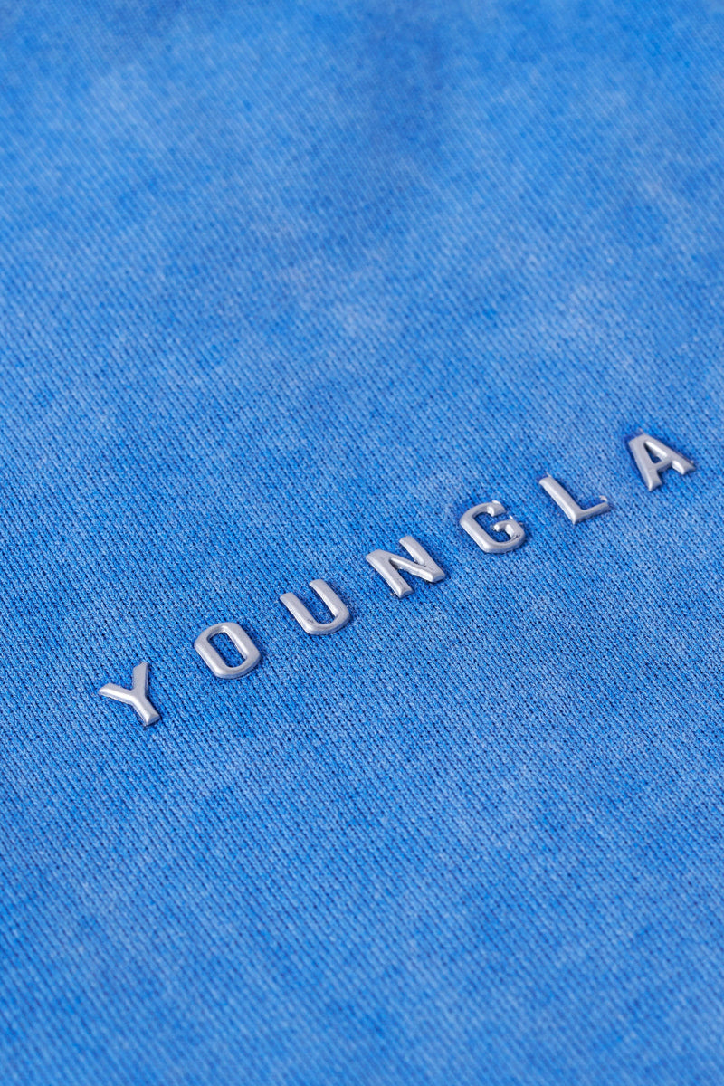 2032 - Superman Sweats - Man of Steel sweatpants from Superman x YoungLA collaboration, acid-wash design, YoungLA chrome logo on left leg, Superman logo on right, baggy fit for comfortable everyday wear in Blue Wash
