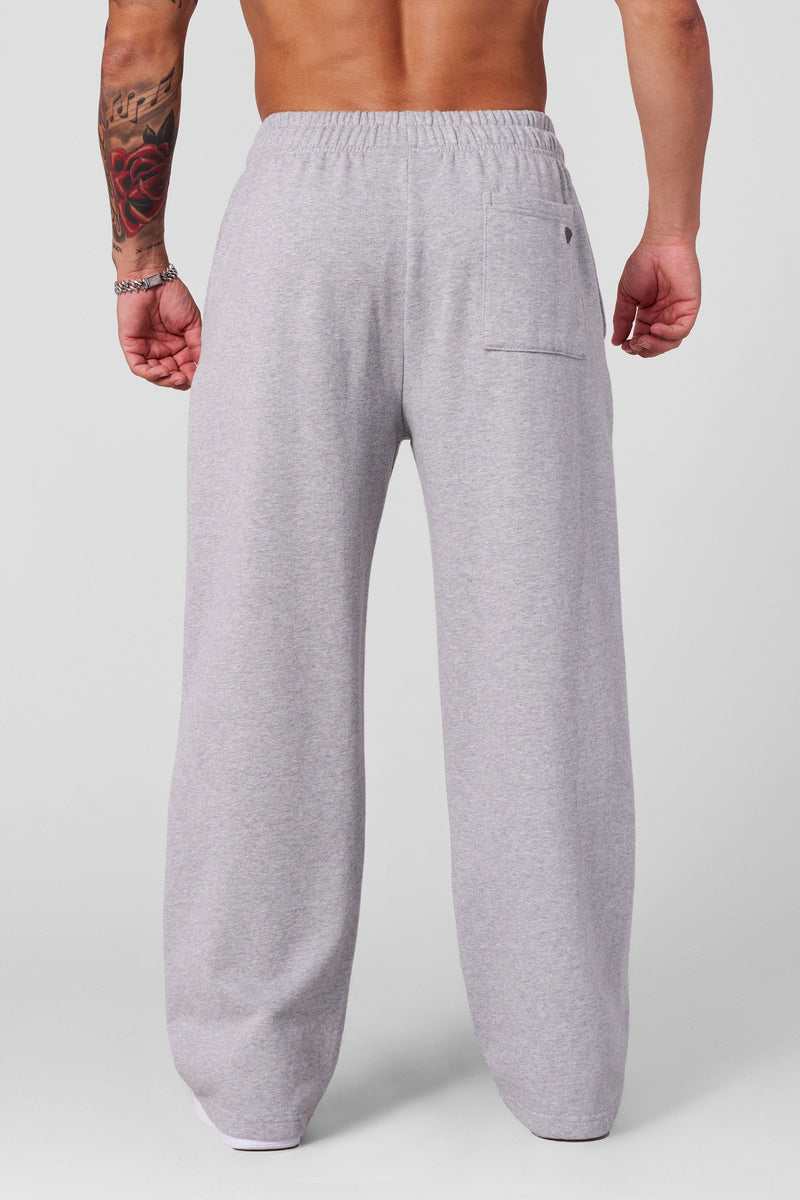 2032 - Superman Sweats - Man of Steel sweatpants from Superman x YoungLA collaboration, acid-wash design, YoungLA chrome logo on left leg, Superman logo on right, baggy fit for comfortable everyday wear in Heather Grey