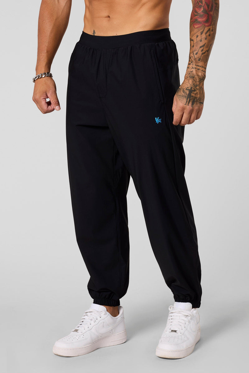 2045 - Ultimate Workout Joggers - Loose-fit, lightweight joggers designed for comfort and unrestricted movement. Breathable and versatile—perfect for the gym or everyday wear in Black.