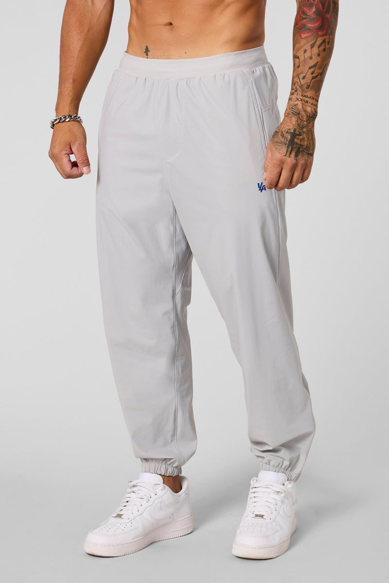 2045 - Ultimate Workout Joggers - Loose-fit, lightweight joggers designed for comfort and unrestricted movement. Breathable and versatile—perfect for the gym or everyday wear in Light Grey.
