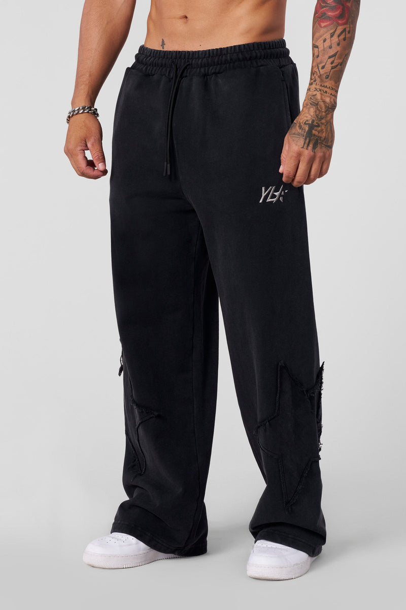 2058 - Superstar Sweats - Superstar Sweats in heavyweight 460 GSM terry cotton with a structured, no-cuff fit. Garment-washed with star patches for a vintage-meets-streetwear look in Black Wash.