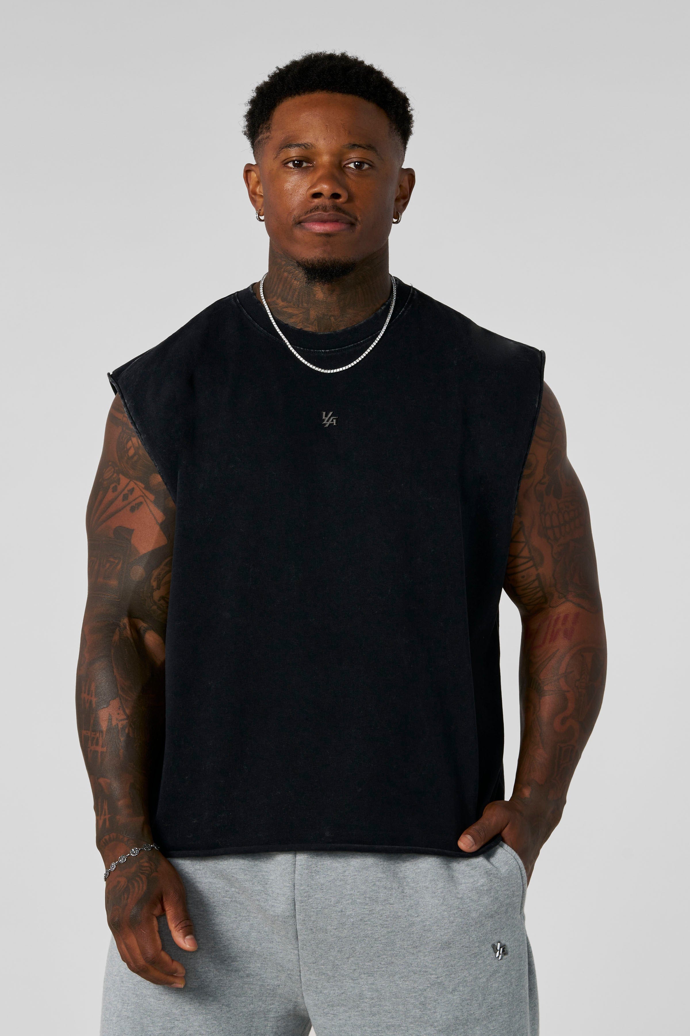 3035 - Elevated Essentials - Cut Offs - Relaxed fleece cut offs with raw-edge hems, lightweight premium cotton, small 'Elevated' logo in colour Black Wash.