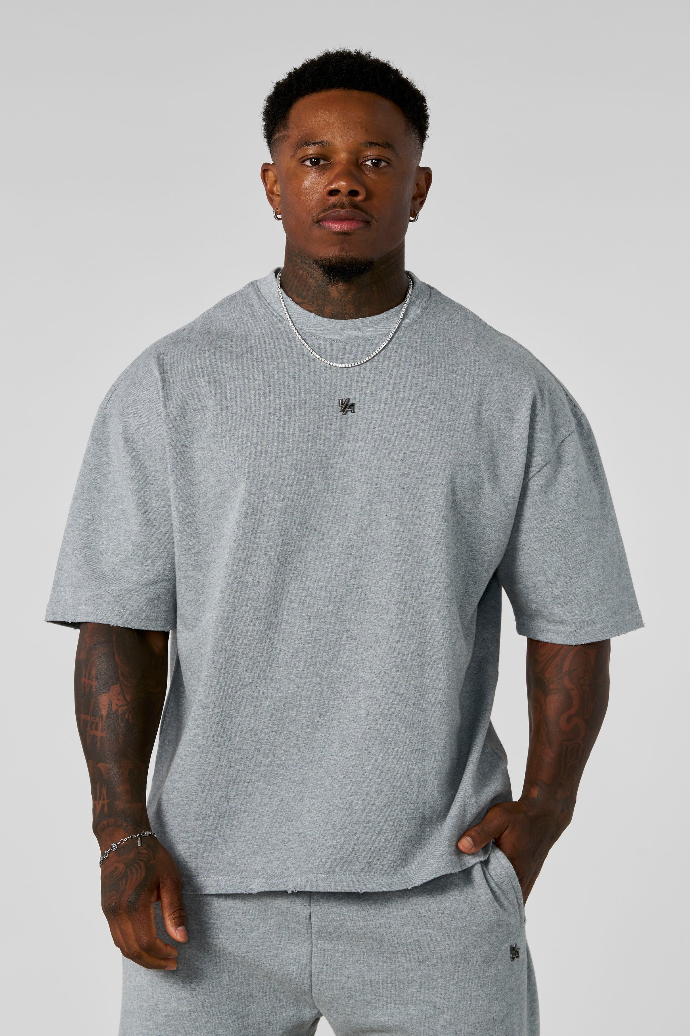 4153 - Elevated Essentials - Relaxed Tee - Oversized heavyweight cotton tee with drop shoulders, natural drape, and subtle 'Elevated' detailing in colour Heather Grey.
