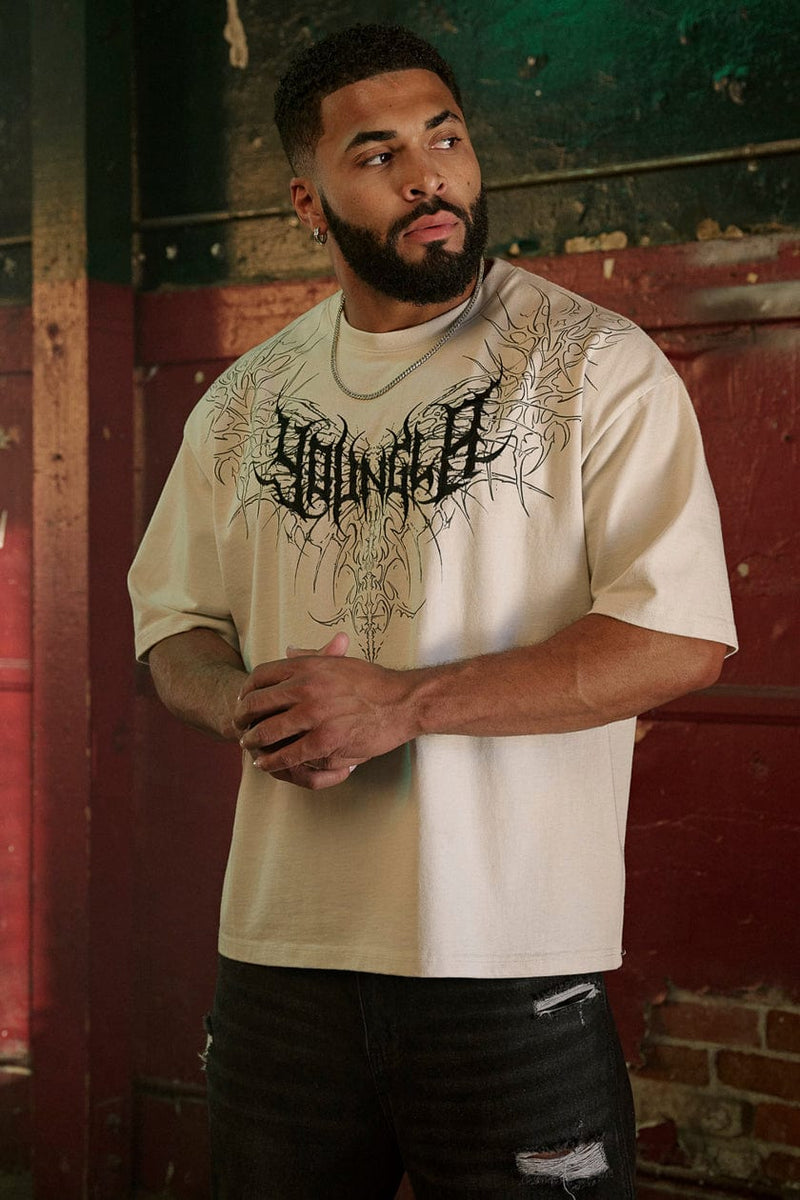 4149 - Gothic Tees- Oversized tee with bold gothic-inspired graphics on the back, structured yet comfortable, offering a sharp, wearable edge and statement-making style in Off-White