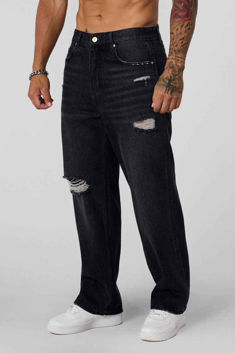 6025 - Straight Fit Ripped Jeans- Straight-leg jeans made from heavy 415 GSM cotton, structured yet softening over time, featuring minimal detailing for a vintage-inspired, timeless look in Black Wash.
