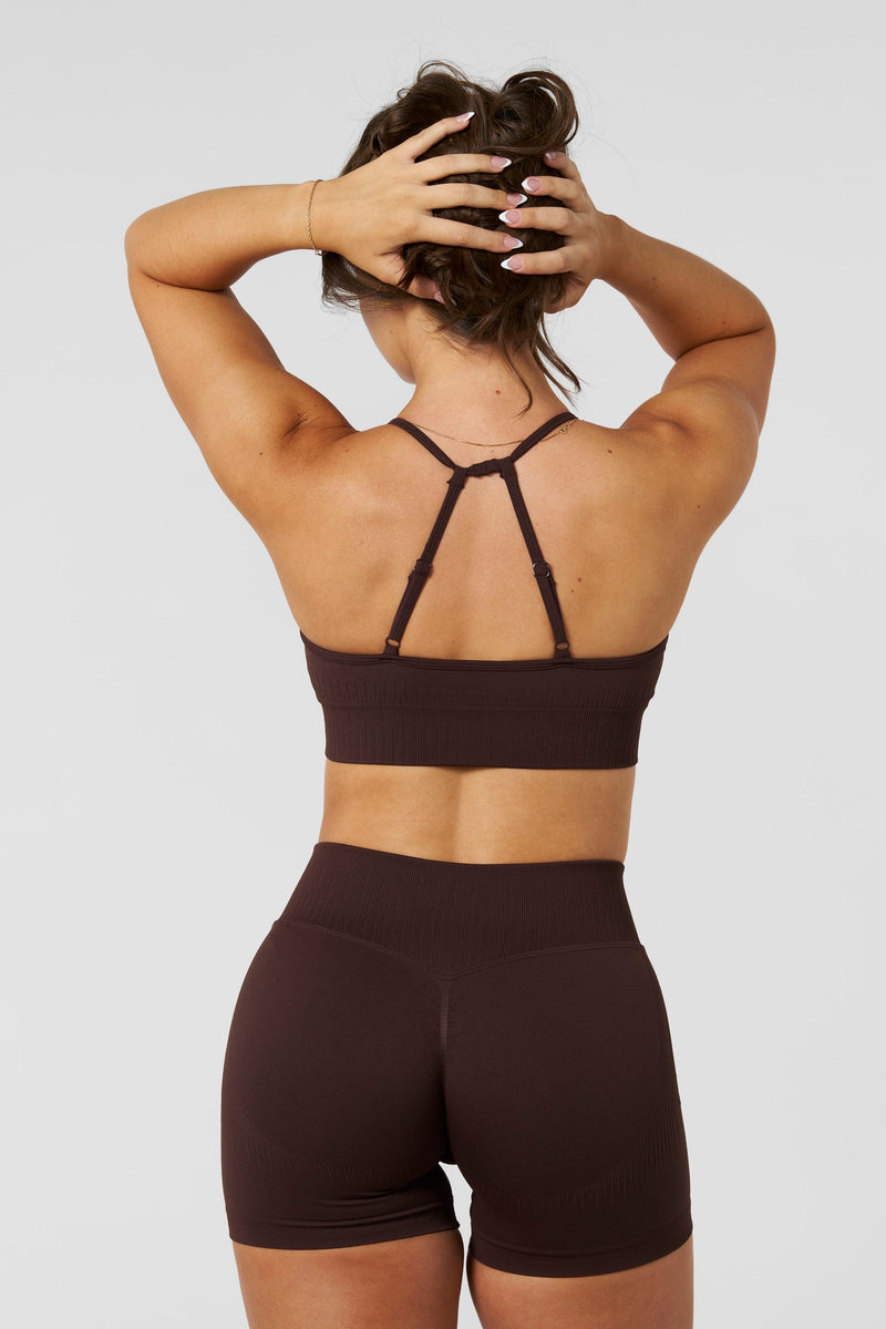 W367 - Sculpt Seamless Plunge Bra - Medium Impact Bra — ultra-soft seamless design with a flattering deep V-neckline and removable padding for adjustable support in colour Brown.