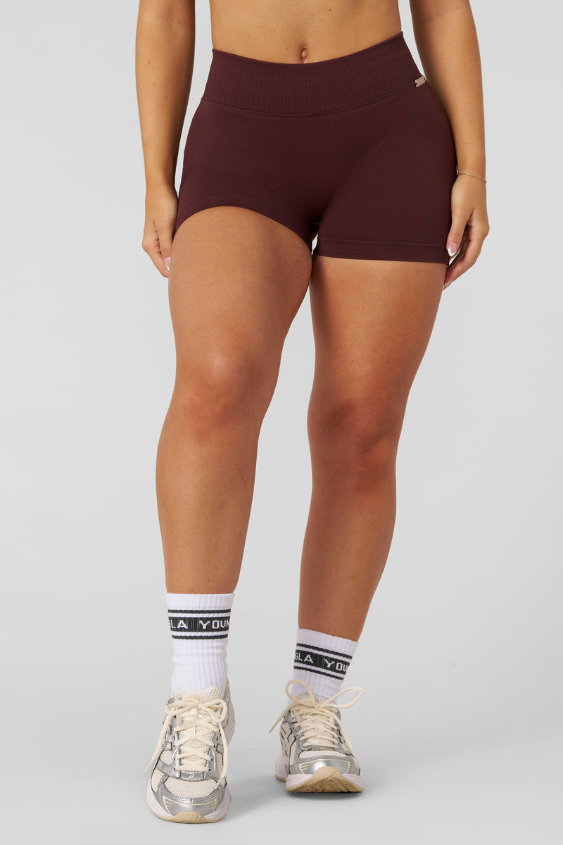 W176 Sculpt Seamless Shorts made from ultra-smooth fabric with contouring panels for a flattering, supportive fit — ideal for workouts or everyday wear in Burgundy color